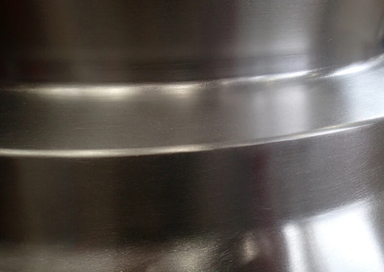 A photo of a curved metallic surface