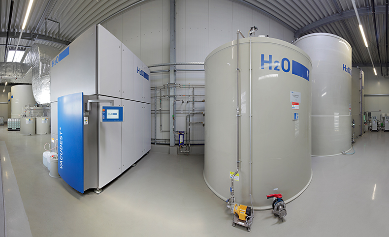 A complete vacuum distillation plant and associated tanks in a clean production environment.