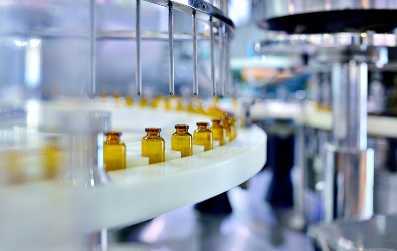 Amber glass bottle filling in pharmaceutical production