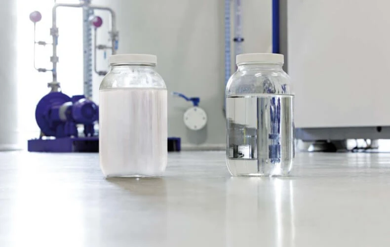 oily and oil-free distillate glasses standing next to each other