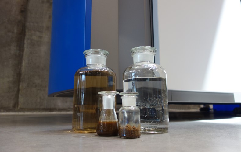 wastewater distillate and residue in bottles
